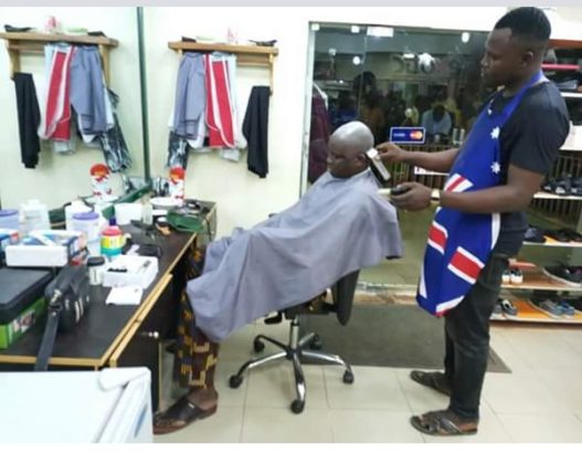 Governor, Fayose, Spotted, Having His Haircut at A Public Barbing Salon