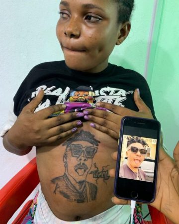 Pregnant Woman Tattoos Mayokun’s Face on Her Stomach