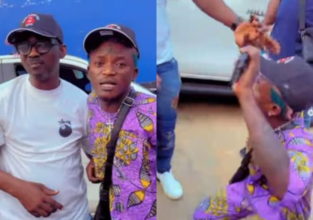 Portable spotted kneeling down to greet Fuji singer Pasuma on the street of Lagos